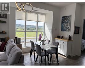 A dining room with a table set for four and a view of the outdoors.