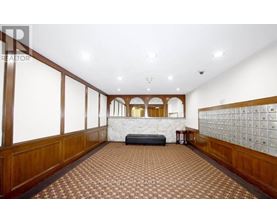 A spacious room with a checkered floor and wooden paneling on the walls.