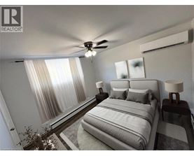 A bedroom with a large bed and a ceiling fan.