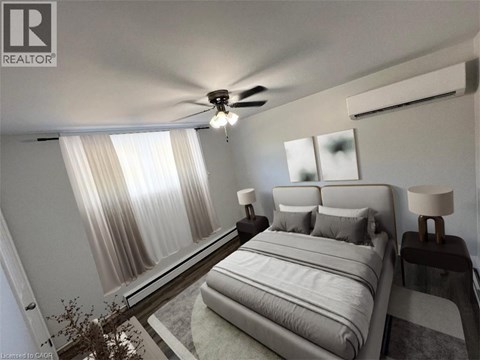 A bedroom with a large bed and a ceiling fan.