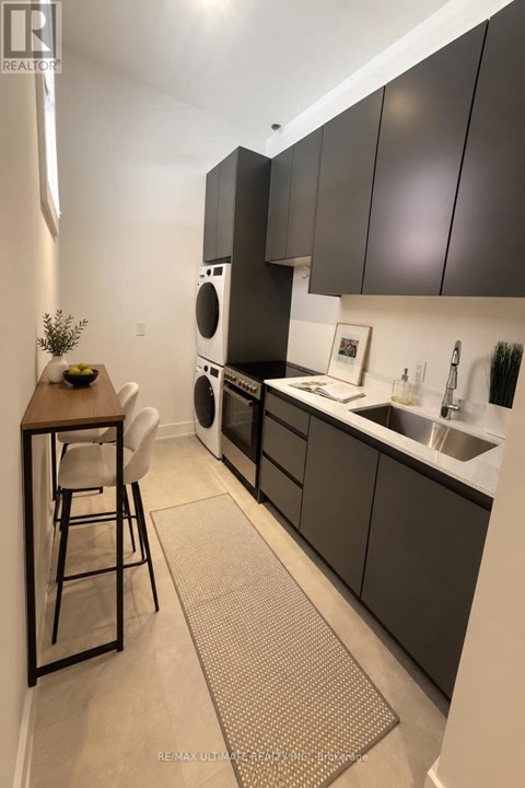 A modern kitchen with dark brown cabinets and a white countertop.