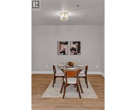 A dining room with a table set for two.