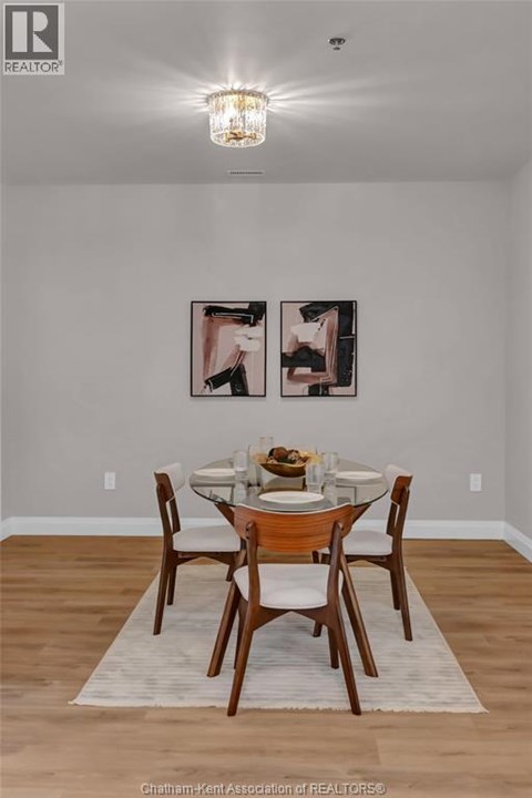 A dining room with a table set for two.