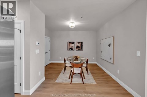 A dining room with a table set for two.