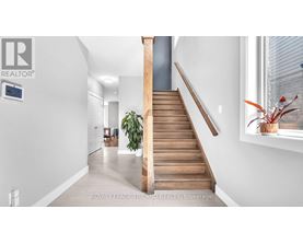 A staircase with wooden steps and a handrail.