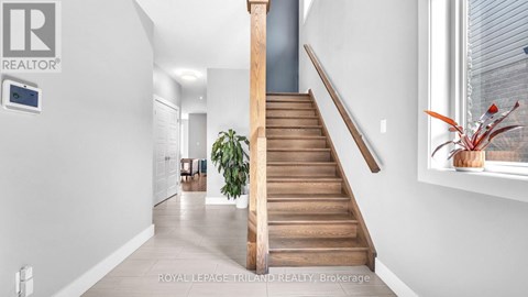 A staircase with wooden steps and a handrail.