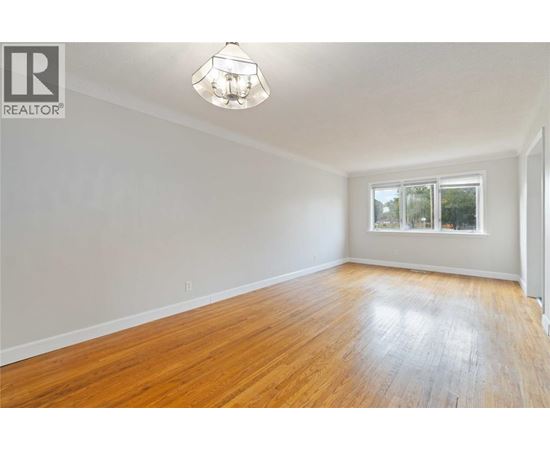 A room with wooden floors and a window.
