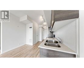 A modern kitchen with a sink and a countertop.