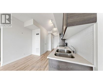 A modern kitchen with a sink and a countertop.
