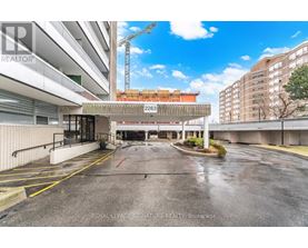 A parking lot with a Royal LePage Signature Realty Brokerage sign.
