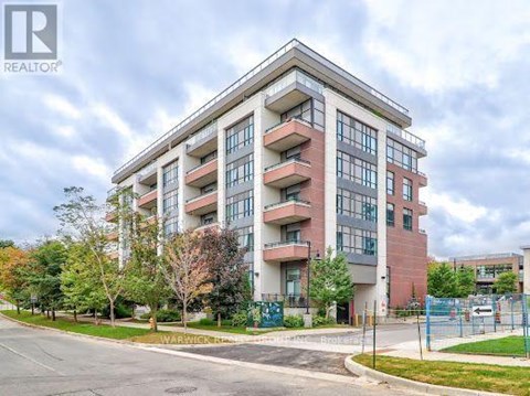 A large apartment building with a sign that says "WARWICK" in front of it.