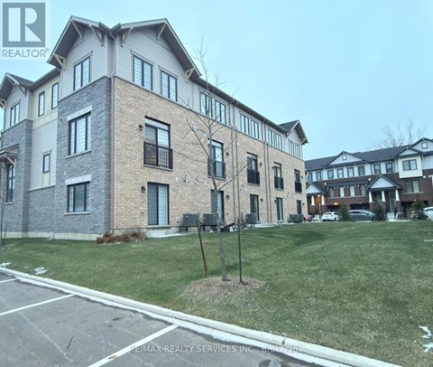 A building with a sign that says RE/MAX Realty Services Inc.