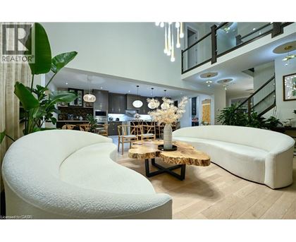 A modern living room with a white sofa and a wooden coffee table.