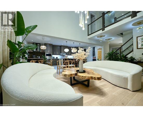 A modern living room with a white sofa and a wooden coffee table.