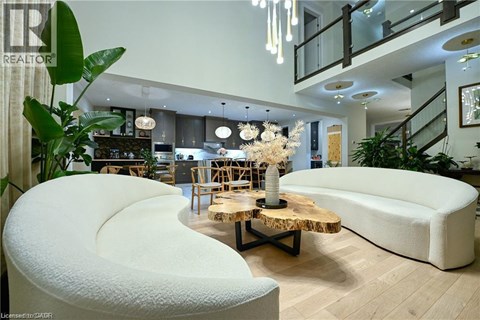 A modern living room with a white sofa and a wooden coffee table.