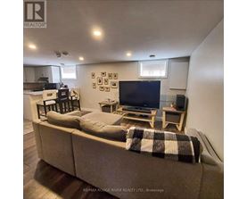A living room with a couch, a television, and a coffee table.