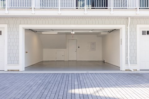 A white building with a white door and a white wall.