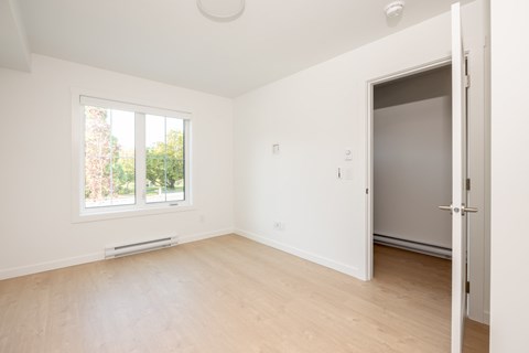 A room with a window and a door.