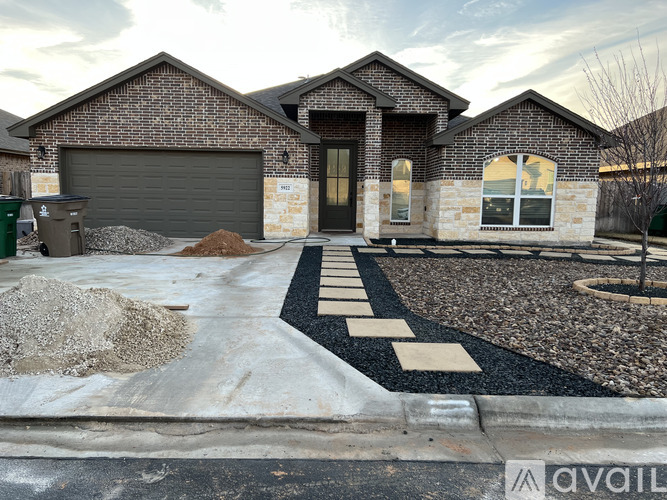 A house with a driveway in front of it.