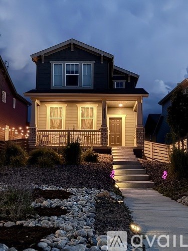 A house with a front yard and a walkway leading to the front door.