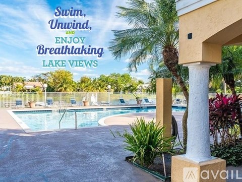 A pool surrounded by palm trees and plants with the text "Swim, Unwind, and Enjoy Breathtaking Lake Views".