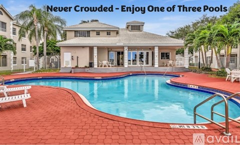 A large house with a pool and a sign that says "Never Crowded - Enjoy One of Three Pools".