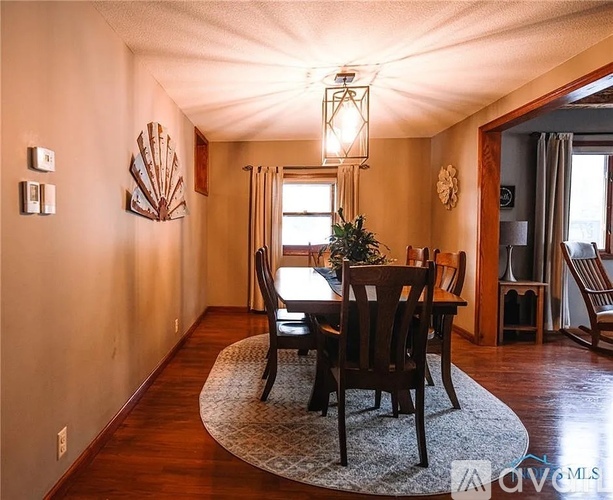 A dining room with a table set for two.
