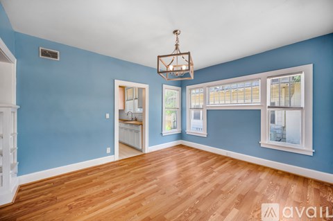 A room with blue walls and wooden floors.
