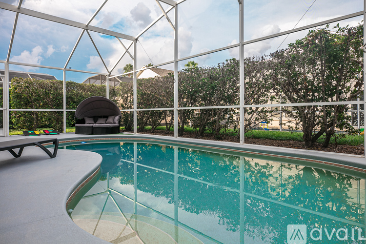 A pool with a glass wall surrounding it.