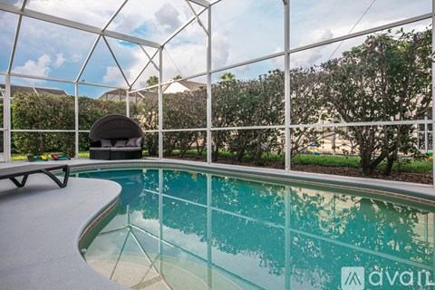 A pool with a glass wall surrounding it.