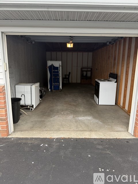 A storage unit with a white refrigerator and a white freezer.
