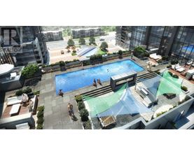 A swimming pool with people in it and a building in the background.
