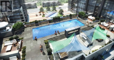 A swimming pool with people in it and a building in the background.