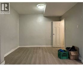 A room with a door and a light on the ceiling.