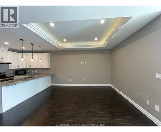 A kitchen with a counter top and cabinets.