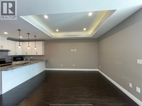 A kitchen with a counter top and cabinets.