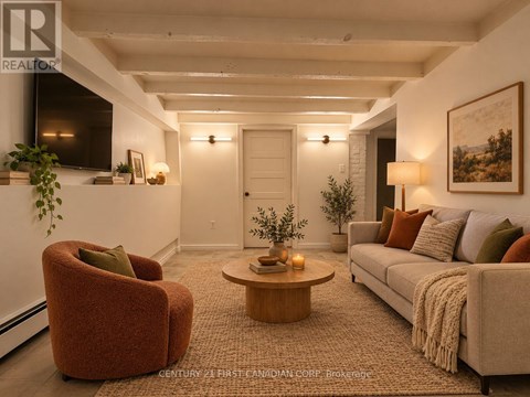 A living room with a red chair, a grey couch, and a coffee table.