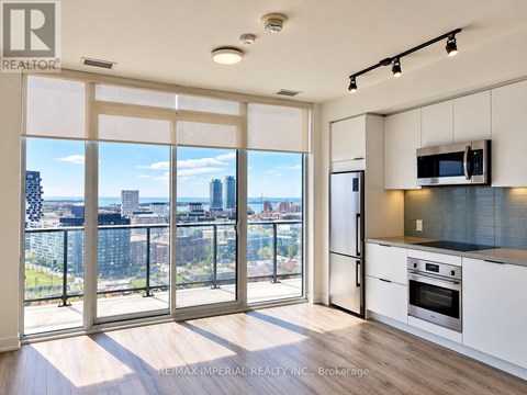 A kitchen with a view of the city.