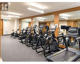 A gym with treadmills and exercise bikes.