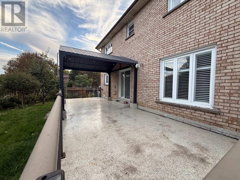 A house with a driveway and a covered walkway.