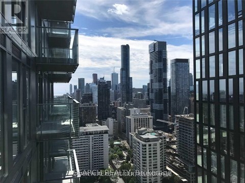 A cityscape with tall buildings and a clear sky.