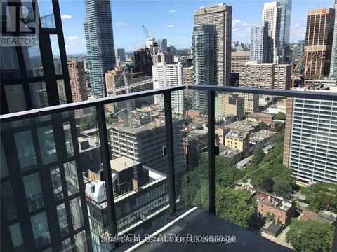 A view from a high-rise building looking out over a cityscape.