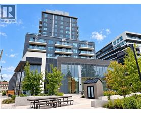 A modern building with glass windows and a wooden entrance.