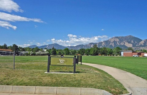 A sign in a park reads "Park".