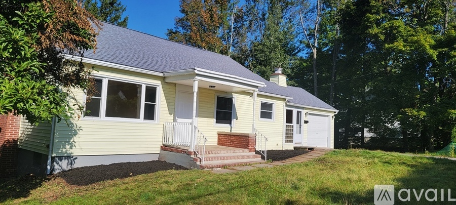 A house with a porch and a sign that says "available".