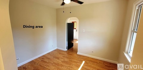 A room with a dining area sign on the wall.