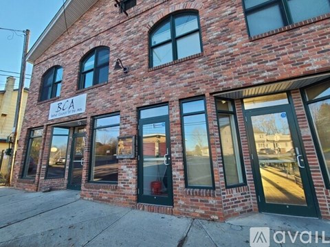 A brick building with a sign that says BCA.