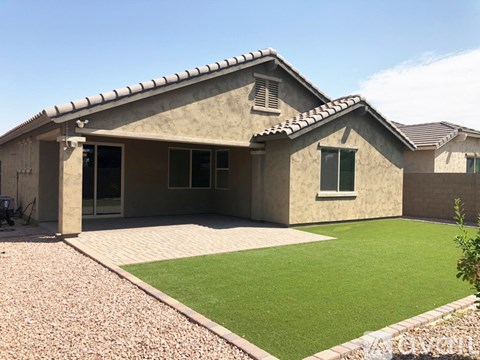A house with a patio and a small garden.