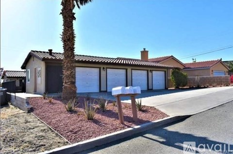 A house with a palm tree in front of it.