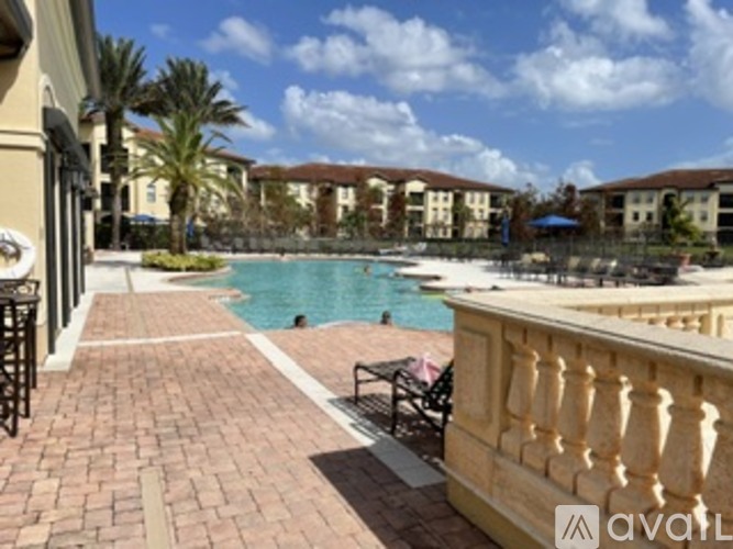 A pool area with a bench and a fence.